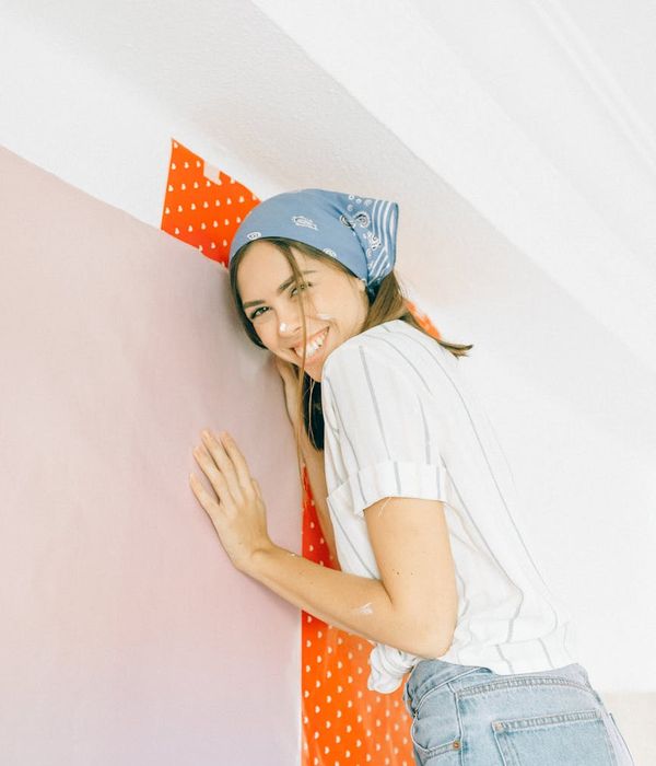 Woman feeling energetic and positive in a bright room.